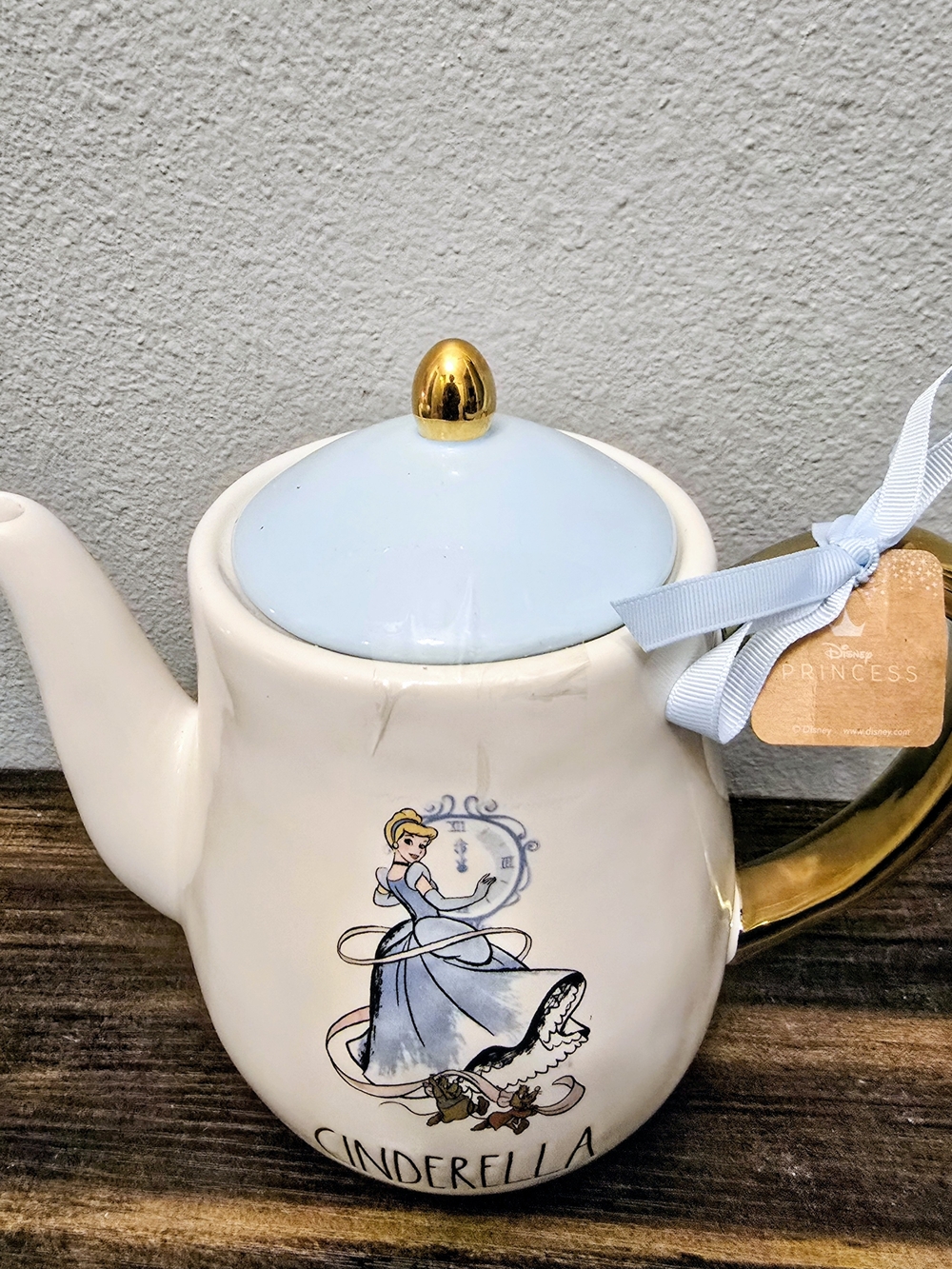 Rae Dunn Rare Cinderella Ceramic Teapot in Light Blue, White & Gold Accent.